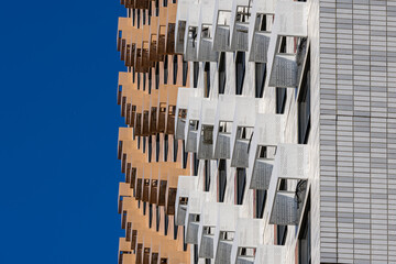 Baskets for placing outdoor air conditioner units on the facade of a new multi-story residential building. Climate control system in a residential building
