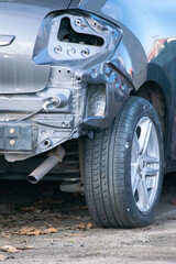 The rear of a car showing heavy damage after a traffic accident.