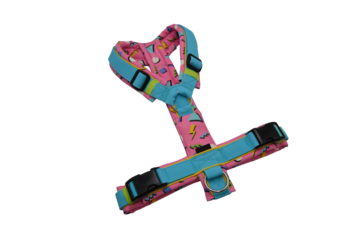 Pink dog harness with blue trim and geometric pattern pet accessory