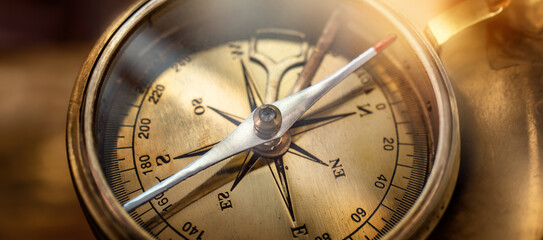 Old compass. Macro shot, shallow focus. Travel, geography, navigation, tourism and exploration concept background.