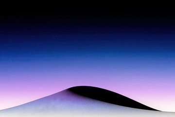 Dark dune against gradient sky