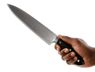 A culinary professional's hand confidently wields a gleaming chef's knife, its sharp blade