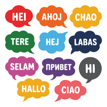 Colorful speech bubbles displaying greetings in different languages on a white background surface view