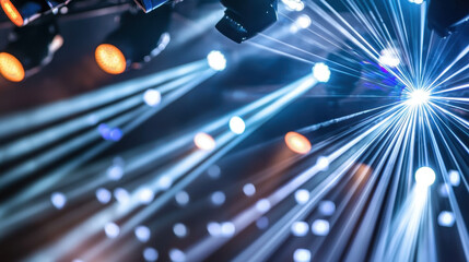 Stage with layered light beams creating vibrant atmosphere, showcasing dynamic lighting effects and colorful beams