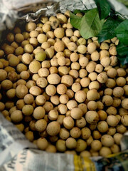 Fresh Longan Fruits in Traditional Market Basket