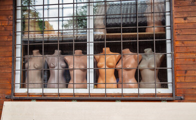 Mannequin torsos in a shop window