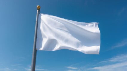 A white flag waving gracefully against a clear blue sky, symbolizing peace and neutrality