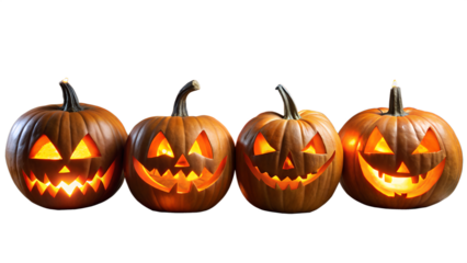 Four carved halloween pumpkins with glowing faces, isolated on transparent background