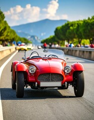 Vintage red roadster on scenic highway