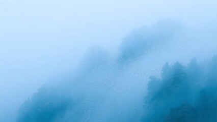 Misty Mountain Landscape with Fog Enveloping Trees