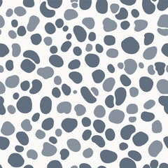 A pattern of organic gray and blue pebbles scattered across a white background