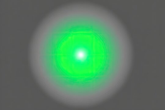 Circular, vibrant green light radiating outwards on a gray background
