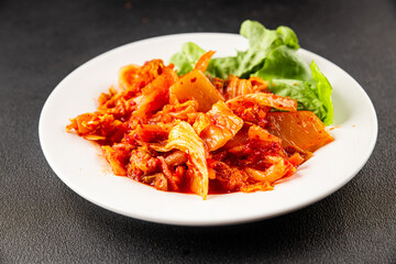 Kimchi pickled cabbage salad spicy savory vegetables fresh delicious gourmet food background on the table rustic food top view copy space vegetarian and vegan food