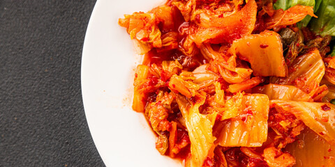 Kimchi pickled cabbage salad spicy savory vegetables fresh delicious gourmet food background on the table rustic food top view copy space vegetarian and vegan food