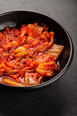 Kimchi pickled cabbage salad spicy savory vegetables fresh delicious gourmet food background on the table rustic food top view copy space vegetarian and vegan food