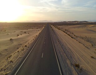 Empty highway stretching into a desert landscape at sunset (1)