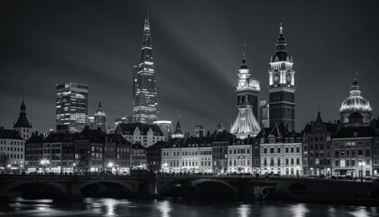 Fototapeta premium Nighttime Monochromatic Cityscape with Illuminated Clock Tower