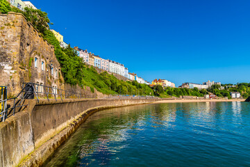 A view along the North Beach promenade in the early morning in Tenby, South Wales in summertime