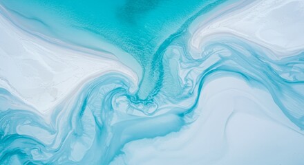 Aerial view of light blue ocean water meeting sandy shore