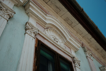 Obraz premium Detail of vintage window frame with decorative stucco elements in Apatin, Serbia.