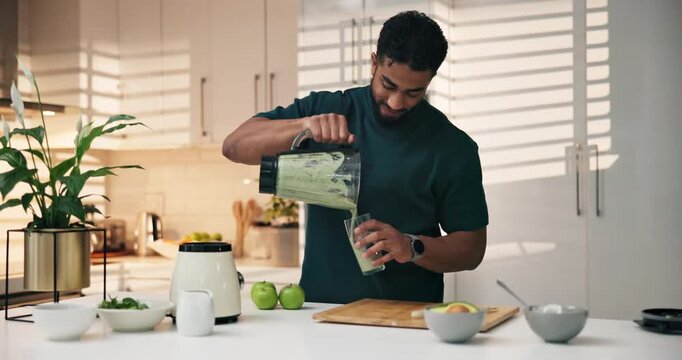 Man, blender and pour green drink with glass, smoothie and container for liquid diet in kitchen. Person, fruits and milkshake for wellness, nutrition and detox for gut health benefits at apartment