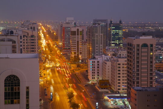 City skyline and Rashid Bin Saeed Al Maktoum Street at dusk, Abu Dhabi, United Arab Emirates, Middle East 