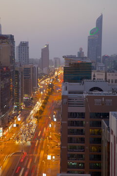City skyline and Rashid Bin Saeed Al Maktoum Street at dusk, Abu Dhabi, United Arab Emirates, Middle East 