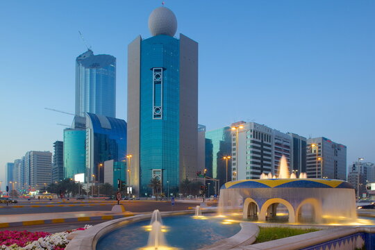 City skyline on Rashid Bin Saeed Al Maktoum Street at dusk, Abu Dhabi, United Arab Emirates, Middle East 