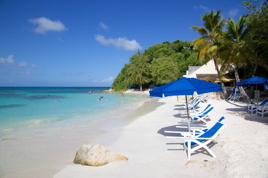 Beach and sunshades, Long Bay, Antigua, Leeward Islands, West Indies, Caribbean