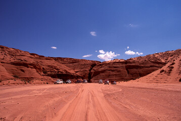 Antelope Canyon entrance with blue sky and clouds