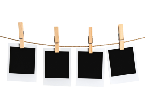 Blank polaroid photos on string with clothespins. Design, mockup, nostalgia, memories, photography, vintage, decoration, creativity, concept, design element.