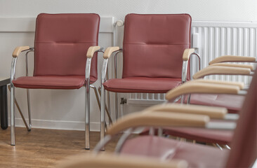 Fototapeta premium Empty Red Chairs in a Waiting Room