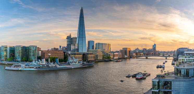 View of The Shard, HMS Belfast and River Thames from Cheval Three Quays at sunset, London, England