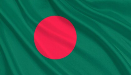 Bangladeshi national flag with red circle on a green field, symbolizing bloodshed and lush land, shown in gentle daylight