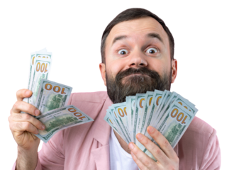 Portrait of a contented young businessman with a beard dressed in a pink jacket showing us dollar banknotes against a red studio background. Taste, smell of money.