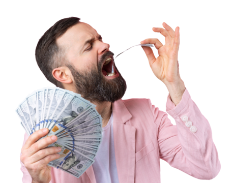Portrait of a contented young businessman with a beard dressed in a pink jacket showing us dollar banknotes against a red studio background. Taste, smell of money.