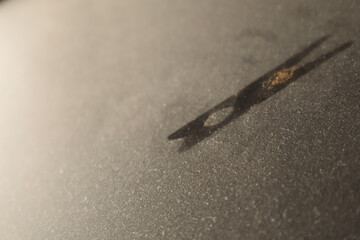 White micro dust on black background. Texture grunge background with tiny white dust. Home cleaning concept.