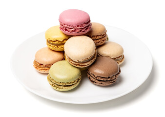Obraz premium Small tasty sweet original classic macaroons cakes on plate isolated on white studio background