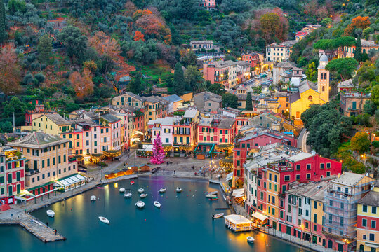 Portofino, Italy fishing village and commune in the Metropolitan City of Genova at dusk.