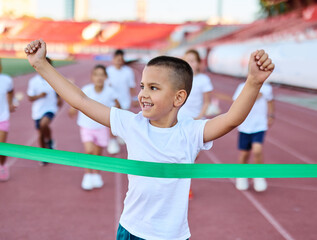 Young children having athletic exercise class running on the track, healthy lifestyle and children...