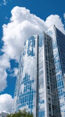 Fototapeta premium Modern glass building facade with blue windows and curved lines in London showcasing business center architecture