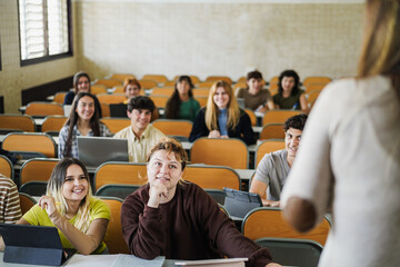 Woman teacher doing university class at college - Campus lifestyle and back to school concept - Focus on curvy girl face
