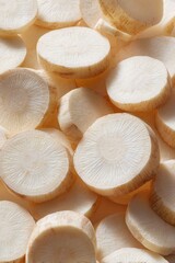 Pile Of Sliced White Radishes On A Light Background With Soft Shadows And Textures