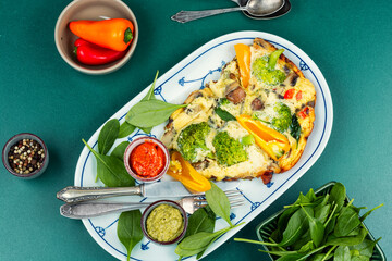 Omelet with broccoli and pepper.