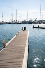Obraz premium View of yachts moored in a small coastal town on the shores of the Mediterranean sea