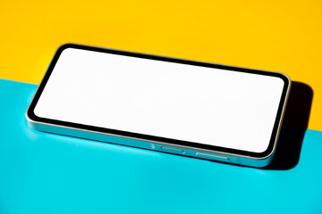 Banner, template, free background, blank phone screen. Mockup. Yellow and blue background - diagonal layout