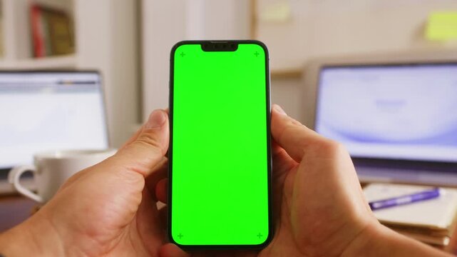Phone with chroma key green screen man working with chatbot AI online, connecting with AI and using a chat. High quality 4k footage