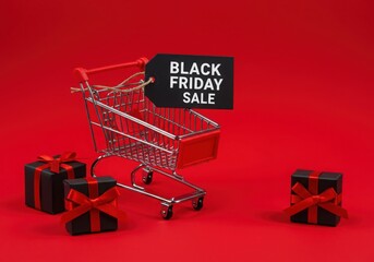Shopping cart with sale tag and gifts on a vibrant red surface