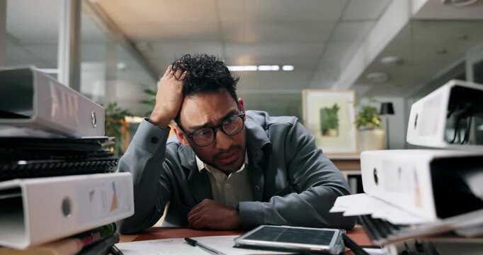 Pile, stress and business man at desk with documents for deadline, tasks and work load. Thinking, office and overwhelmed person with paperwork, files and report for burnout, frustrated and overworked
