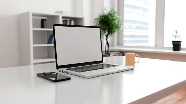 Modern desk with laptop and coffee